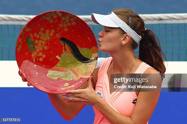 Agnieszka Radwanska of Poland poses with the trophy after winning the women's final match against Vera Zvonareva of Russia during the day seven of...