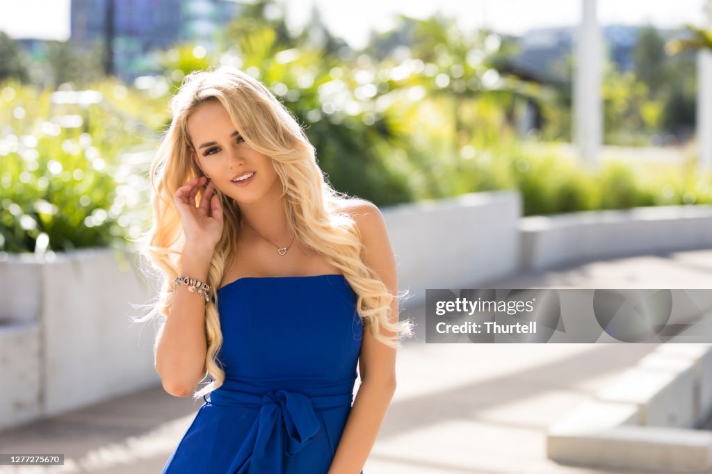 Blonde Woman In Blue Formal Dress