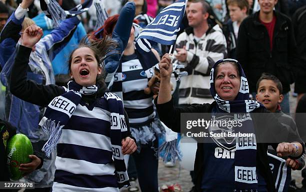 Geelong Cats supporters celebrate as they watch the 2011 AFL Grand Final match between the Collingwood Magpies and the Geelong Cats at Federation...