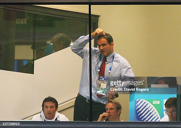Martin Johnson, manager of England scratches his head during the IRB 2011 Rugby World Cup Pool B match between England and Scotland at Eden Park on...