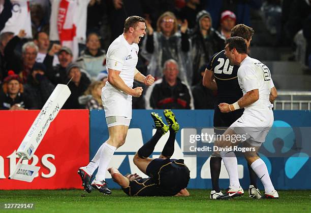 Chris Ashton of England celebrates his try with Ben Foden during the IRB 2011 Rugby World Cup Pool B match between England and Scotland at Eden Park...