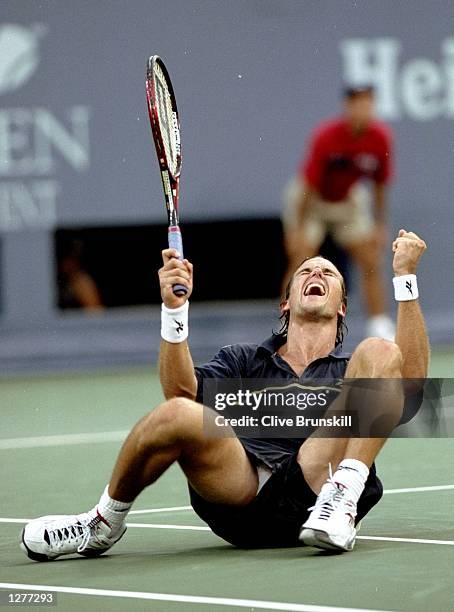 Patrick Rafter Arms Patrick Rafter of Australia celebrates match point during his match ...