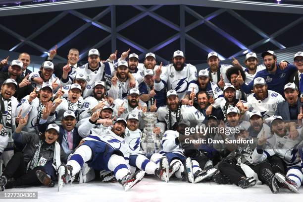 Captain Steven Stamkos and his Tampa Bay Lightning teammates pose on the ice with the Stanley Cup after the Tampa Bay Lightning defeated the Dallas...