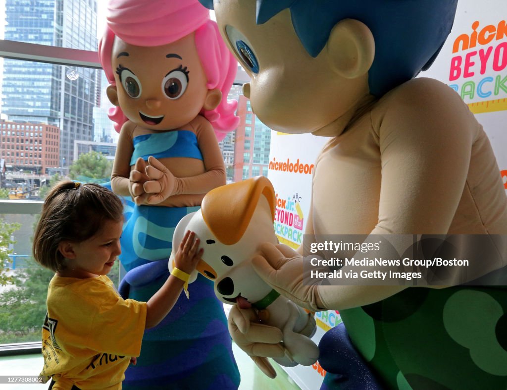 BOSTON MA. - AUGUST 27: Adelene Raimo, 4, greets the Bubble Guppies as Boston Public Schools and the Children's Museum team up to welcome kindigardeners to the new school year on August 27, 2019 in Boston, MA. (Staff Photo By Stuart Cahill/MediaNews Gro