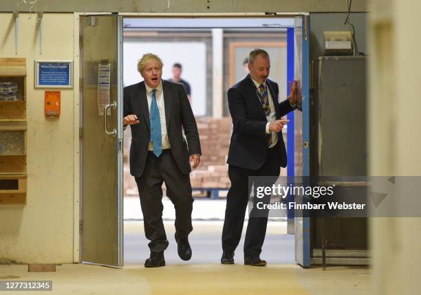British Prime Minister Boris Johnson during his visit to Exeter College, with CEO John Laramy on September 29, 2020 in Exeter, England. In a bid to...