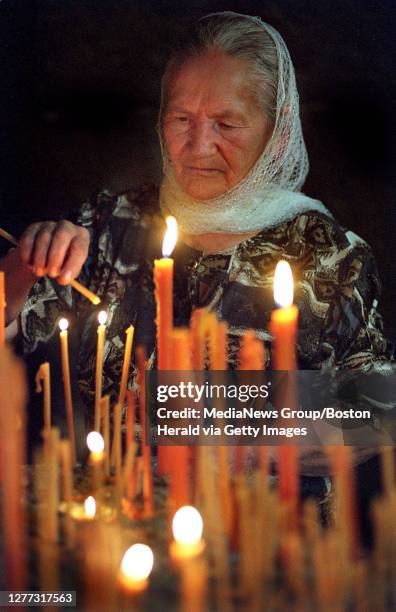 Year old Gayane Melkonyan lights prayer candles inside St. Hripsime church. Having been largely deprived of free expression of religion for over 75...
