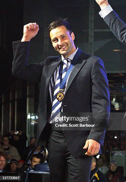 Jimmy Bartel of the Cats gestures to the crowd after the 2011 AFL Grand Final match between the Collingwood Magpies and the Geelong Cats at...