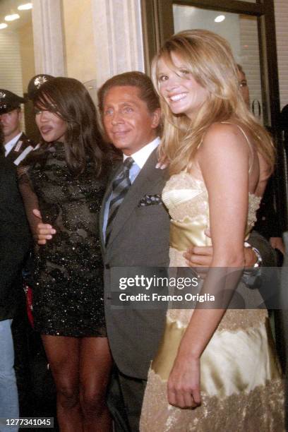 Italian fashion designer Valentino, whose real name is Valentino Garavani, and top models Naomi Campbell and Elle Macpherson attend the inauguration...
