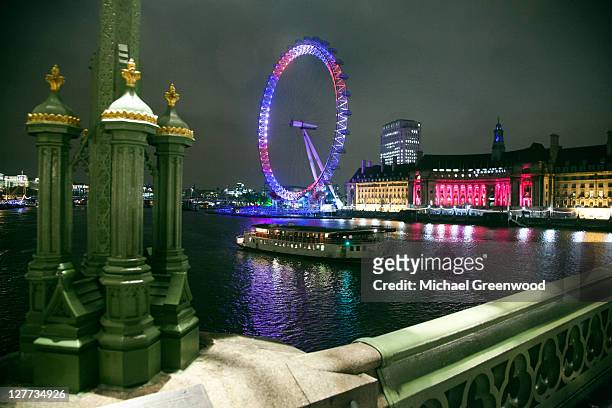 london eye lit for royal wedding - river thames night stock pictures, royalty-free photos & images