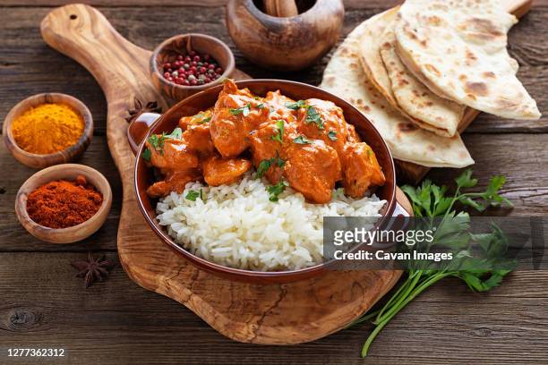 chicken tikka masala spicy curry meat food in a clay plate with rice - tikka masala stock pictures, royalty-free photos & images