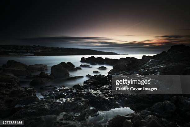 long exposure, rocks, setting sun - black rock stock pictures, royalty-free photos & images