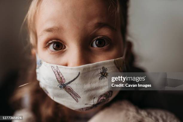 detailed close up portrait of young girl with mask on - nose mask - fotografias e filmes do acervo