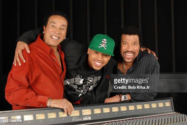 Smokey Robinson, Chris Brown and Lionel Ritchie prior to performance together on Grammy Awards Show, February 5, 2007 in Los Angeles, California.