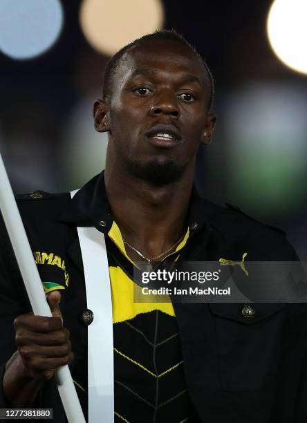 Usain Bolt is seen as he leads the Jamaican team as they enter the stadium during the Opening Ceremony of the London 2012 Olympic Games, directed by...