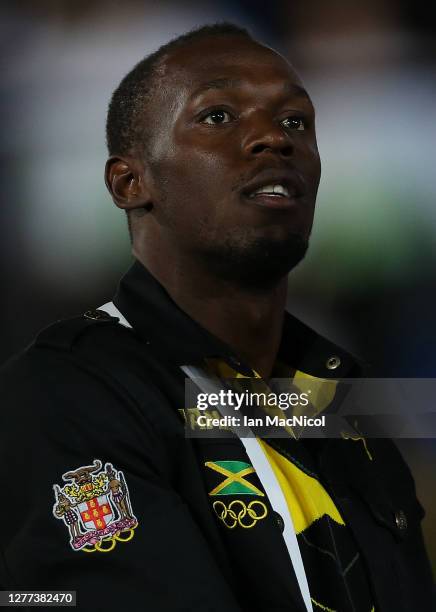 Usain Bolt is seen as he leads the Jamaican team as they enter the stadium during the Opening Ceremony of the London 2012 Olympic Games, directed by...