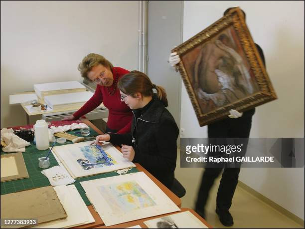In the drawings restoration workshop of the Malraux museum . Helene Senn-Foulds watches restorer Agnes Gaudu as she reconditons a watercolor by...