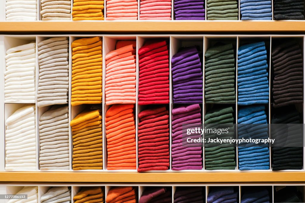 Colorful Horizontal Various socks on Wooden Shelf in cloth store