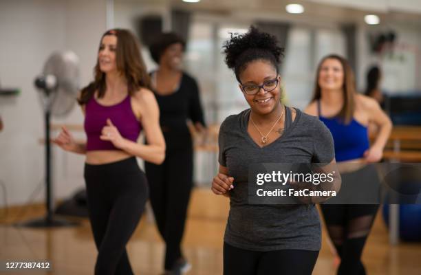 women having fun dancing in fitness class - ymca dance stock pictures, royalty-free photos & images