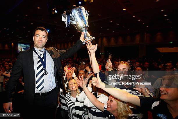 Chris Scott holds the premiership cup with fans during Geelong Cats AFL Grand Final celebrations at Melbourne Park on October 1, 2011 in Melbourne,...