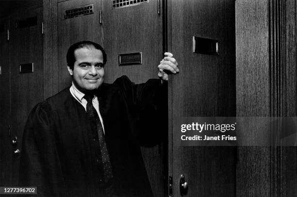 Portrait of American jurist and US Supreme Court Associate Justice Antonin Scalia as he poses beside an open locker door in the Court's Robing Room,...