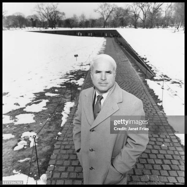 Portrait of American politician US Senator John McCain as he poses in front of the Vietnam Veterans Memorial, Washington DC, February 1986.