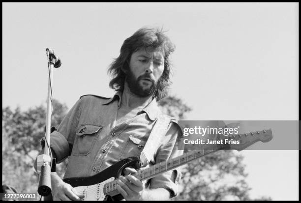 English Blues and Rock musician Eric Clapton plays guitar as he performs onstage, San Francisco, California, August 1975.