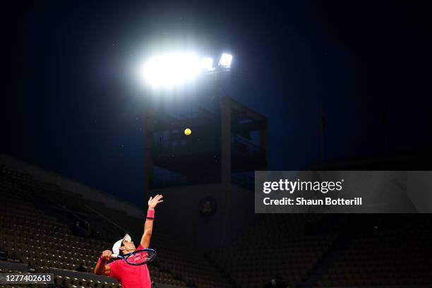 Jaume Munar of Spain serves during his Men's Singles first round match against Stefanos Tsitsipas of Greece on day three of the 2020 French Open at...