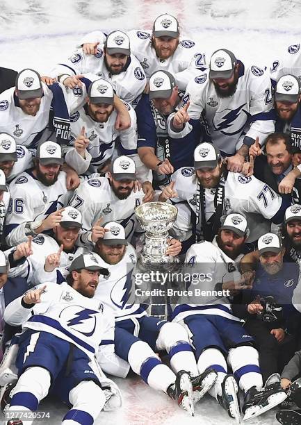 The Tampa Bay Lightning pose with the Stanley Cup 1following the series-winning victory over the Dallas Stars in Game Six of the 2020 NHL Stanley Cup...