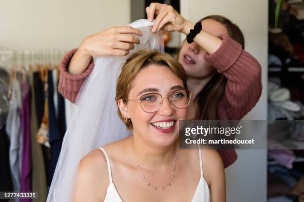 millennial future bride getting ready for wedding. - short wedding dress stock pictures, royalty-free photos & images
