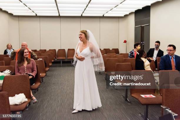 bride with socially distanced guests at wedding during covid. - covid wedding stock pictures, royalty-free photos & images