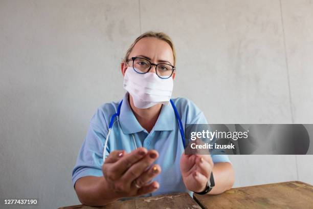 Nurse Using Camera 5,592 Nurse Speaking To Camera Stock Photos, High-Res Pictures, and ...
