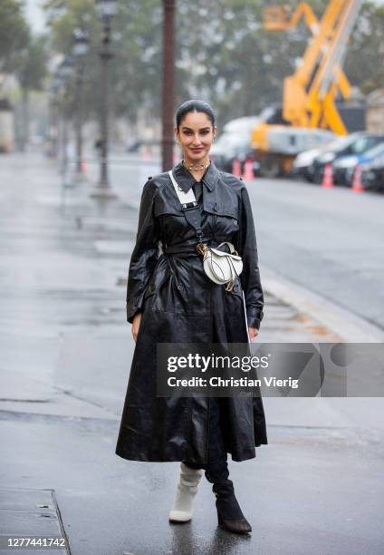 Fiona Zanetti seen wearing black coat, white bag Dior outside Dior during Paris Fashion Week - Womenswear Spring Summer 2021 : Day Two on September...