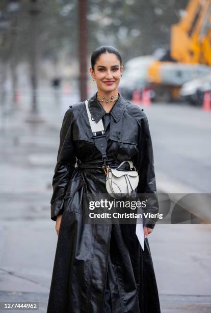 Fiona Zanetti seen wearing black coat, white bag Dior outside Dior during Paris Fashion Week - Womenswear Spring Summer 2021 : Day Two on September...