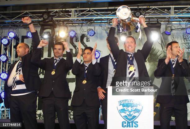 The Geelong Cats arrive with the Premiership Cup after the 2011 AFL Grand Final match between the Collingwood Magpies and the Geelong Cats at...