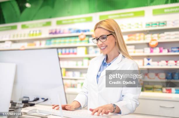 Pharmacist Using Computer Pharmacist On Computer Photos and Premium High Res Pictures - Getty Images