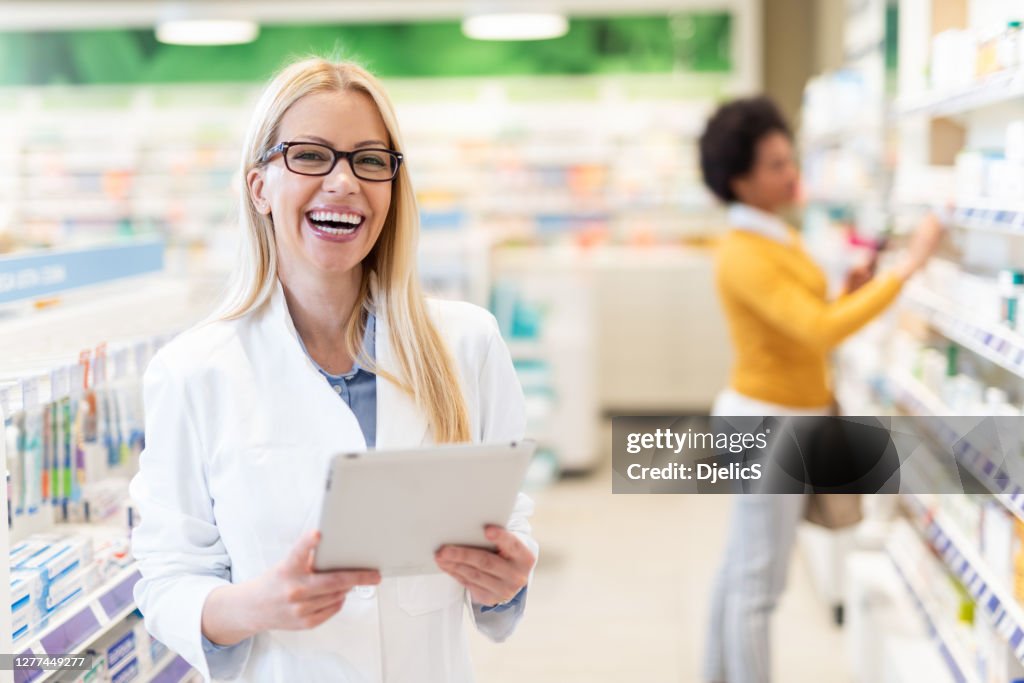 Happy Pharmacist At Work High-Res Stock Photo - Getty Images