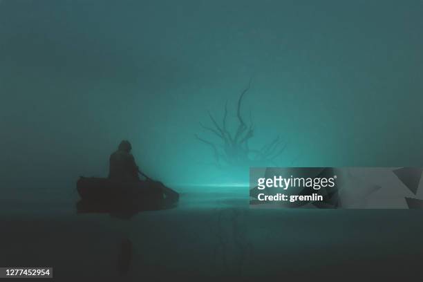 pescador contra monstruo de fantasía - barco salvavidas fotografías e imágenes de stock