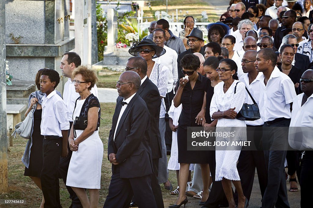 Relatives walk during the funeral ceremo