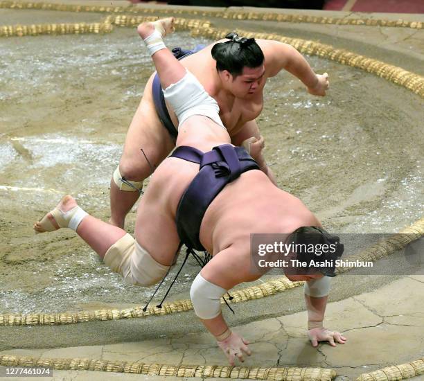 Onosho throws Terunofuji to win on day twelve of the Grand Sumo Autumn Tournament at Ryogoku Kokugikan on September 24, 2020 in Tokyo, Japan.