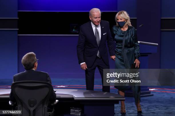 Democratic presidential nominee Joe Biden and his wife Jill Biden speak to debate moderator Chris Wallace after the first presidential debate against...