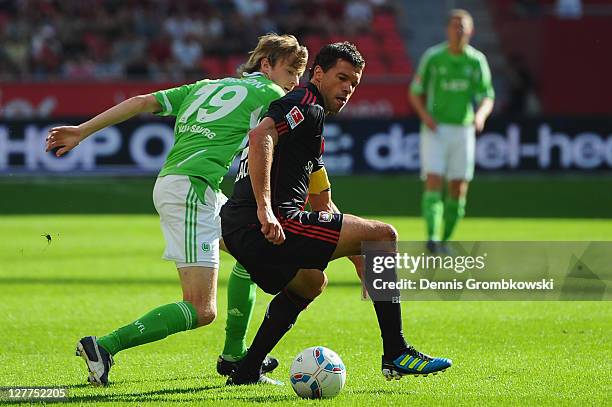 Rasmus Joensson of Wolfsburg chases Michael Ballack of Leverkusen during the Bundesliga match between Bayer 04 Leverkusen and VfL Wolfsburg at...