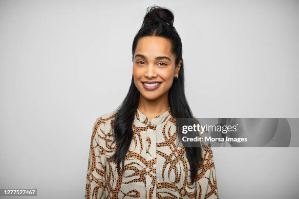 happy african american female ceo wearing printed blouse. - natural portrait studio shot white background stock pictures, royalty-free photos & images