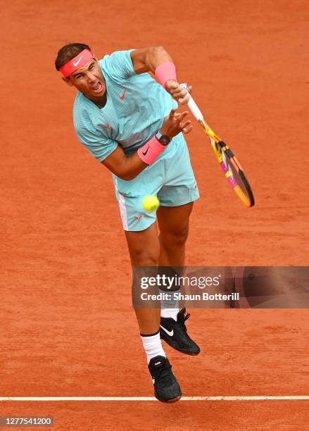 Rafael Nadal of Spain serves during his Men's Singles second round match against Mackenzie McDonald of the United States on day four of the 2020...