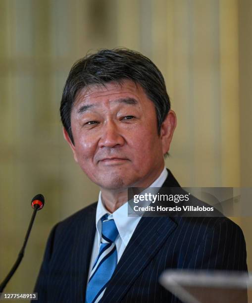 Japanese Foreign Minister Toshimitsu Motegi listens as the Minister of State and Foreign Affairs Augusto Santos Silva delivers remarks to the press...
