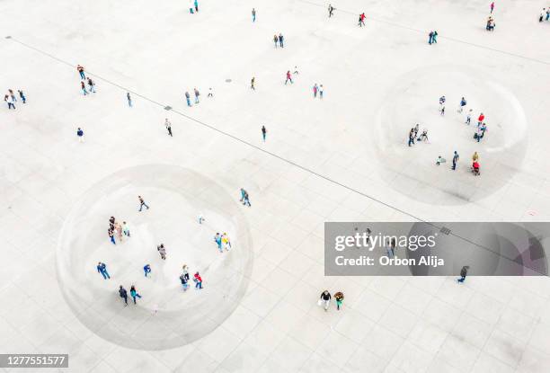 aerial view of people walking in a bubble for covid-19 protection. - aerial courtyard stock pictures, royalty-free photos & images