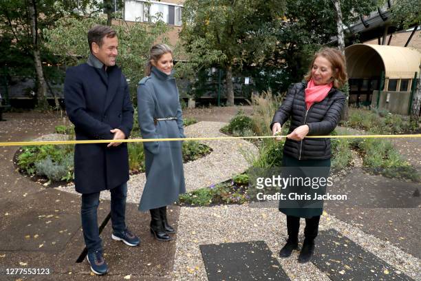 Carly Cole, Joe Cole and Jo Thompson cut the ribbon to launch the 11 Foundation and open their first NHS garden with RHS Chelsea Designer Jo Thompson...