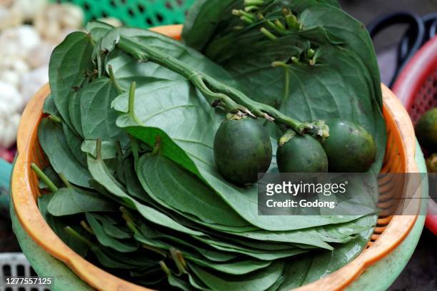 Betel leaves and areca nut for sale at market. Quy Nhon. Vietnam.