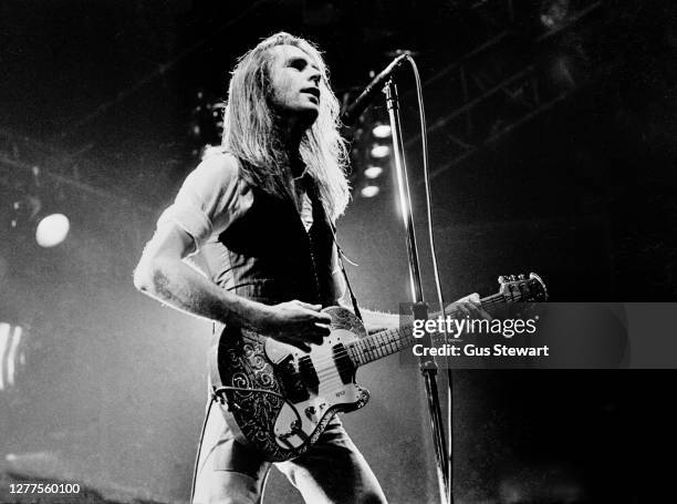 Francis Rossi of Status Quo performs on stage at the Hammersmith Odeon, London, England, on December 13, 1977. He is playing his famous green Fender...
