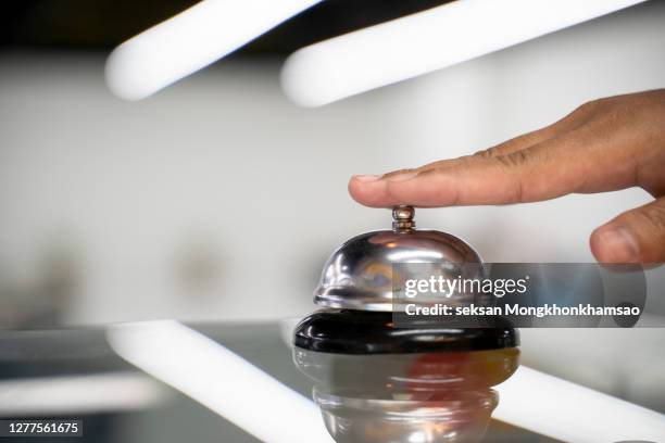 restaurant bell vintage with hand. hotel service bell - receptiebel stockfoto's en -beelden