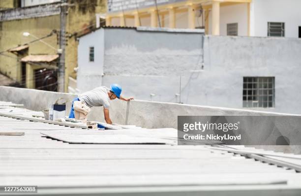 waterproofing a roof - waterproofing stock pictures, royalty-free photos & images